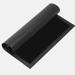 May include: A rolled-up black mat with a textured surface. The mat is partially unrolled, revealing a solid black rectangular area. The edges of the mat have a slightly raised border.