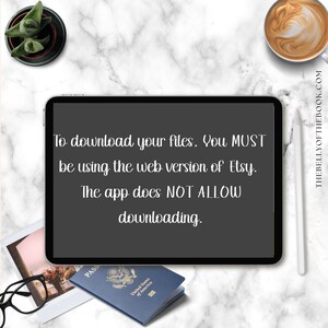 May include: A digital tablet displays text: "To download your files, you MUST be using the web version of Etsy. The app does NOT ALLOW downloading." A passport, glasses, and a photo are on a marble surface.