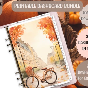 May include: A printable dashboard bundle with 308 dashboards in total, 28 for each size. The image shows a watercolor illustration of a city street with a bicycle and fall foliage. The dashboard is designed for a planner with a ring binder.