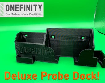 May include: A black 3D printed probe dock with the text "ONEFINITY" and "One Machine Infinite Possibilities" on the front. The dock has two compartments and is labeled "Deluxe Probe Dock!"