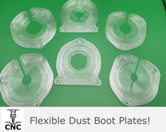 May include: Six clear plastic dust boot plates with a circular design and a center hole. The plates are arranged in a semi-circle on a green surface. The text "Flexible Dust Boot Plates!" is visible at the bottom of the image.