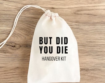 May include: A white cotton drawstring bag with black text that reads "But Did You Die Hangover Kit".