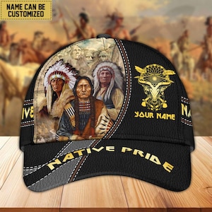 May include: Black baseball cap with a Native American design. The cap features a portrait of Native American chiefs, the text "NATIVE PRIDE", and a customizable name area. The cap has a curved brim and a stitched design.