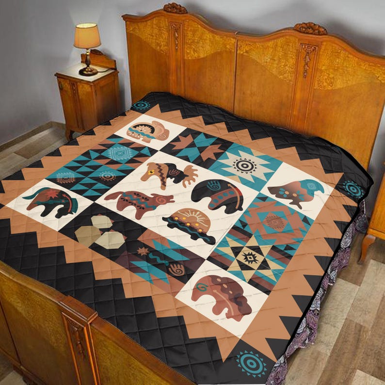 May include: A quilt featuring a Native American design with geometric patterns and animal motifs. The quilt has a black, brown, and teal color scheme. The animal designs include bears, turtles, and other creatures. The quilt is displayed on a wooden bed frame.