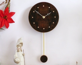 Handmade Wooden Wall Clock. Pendulum Wall Clock in quarter-matched burr walnut with inlaid sycamore dots. Small Circle Clock.