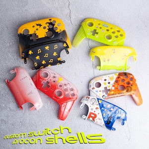 May include: A collection of custom Switch Procon shells in various colors and designs. The shells feature graphics such as musical notes, bats, stars, and cartoon characters. The text "custom switch procon shells" is visible in the image.