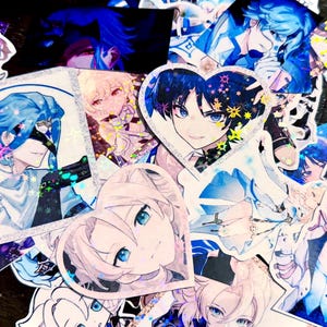 May include: A collection of anime-style stickers featuring various characters in shades of blue, white, and pink. Some stickers have a holographic finish, and several are heart-shaped. The stickers depict detailed illustrations of anime characters.