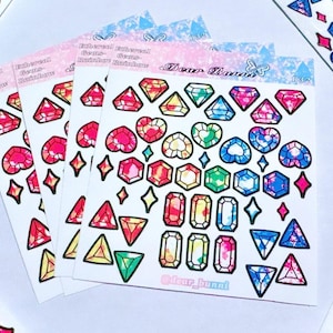 May include: Sheets of stickers featuring colorful, gem-shaped designs. The stickers showcase various shapes, including diamonds, hearts, and rectangles, with vibrant hues of red, pink, blue, green, and yellow. The text "Dear Bunni" is visible on the stickers.