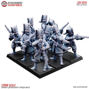 May include: A group of 32mm scale, gray plastic, pre-supported miniatures of Ottoman Janissary Arquebusiers. The miniatures are posed in a firing line formation. The text "Araby Janissary Arquebus" is visible at the bottom of the image.