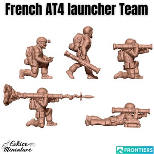 May include: A set of four plastic miniature figures of French soldiers armed with AT4 launchers. The figures are in various poses, including kneeling, standing, and lying down. The figures are painted in a brown color.