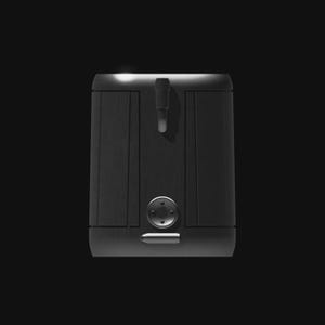 May include: A dark gray, metallic-looking box with a vertical handle and a circular button. The box has a brushed metal texture and a rectangular shape. The background is black.