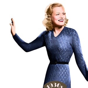 May include: A woman in a blue knitted dress with a diamond pattern. The dress has a V-neck and a black belt. The woman is smiling and has blonde hair. The image is from the 1930s and is labeled "The Workbasket Vintage Patterns".