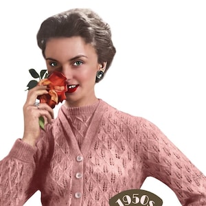 May include: A pink knitted cardigan with a diamond pattern and button closure. The cardigan is worn by a woman with a rose in her hand. The text "1950s THE WORKBASKET Vintage Patterns" is printed on the cardigan.