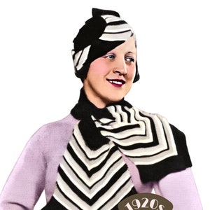 May include: A woman wearing a black and white striped hat, scarf, and gloves. The hat is styled with a large bow. The woman is wearing a light purple sweater. The image includes the text "1920s THE WORKBASKET Vintage Patterns".