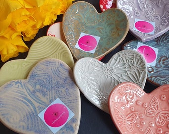 Small handmade ceramic heart shaped trinket dishes in various colours and patterns