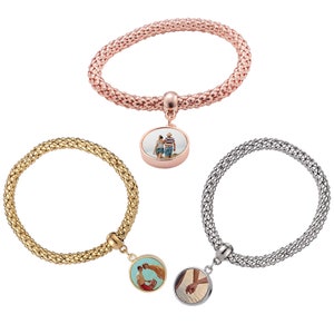 May include: Three bracelets with a charm that can be personalised with a photo. The bracelets are available in rose gold, gold, and silver.