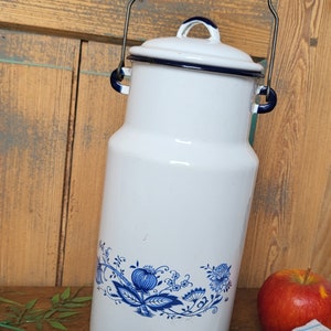 Pretty flowery enameled milk jug with wooden handle