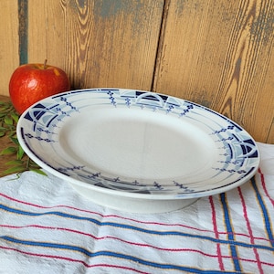 Antique French biscuit plate stamped Moulin des loups and Hamage Orchies