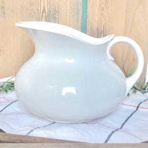 Magnificent French pitcher, toilet jug in white earthenware, stamped Digoin Sarreguemines