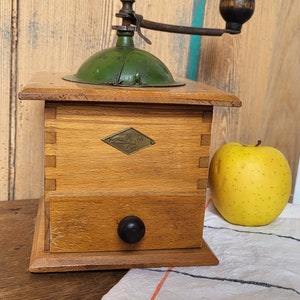 Old wooden and metal coffee grinder