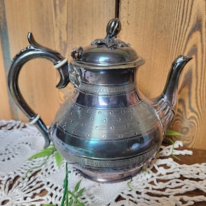 Pretty vintage decorated silver metal coffee pot and teapot circa 1900