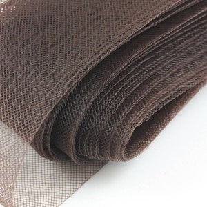 May include: Brown mesh fabric rolled up. The mesh is a fine weave with a diamond pattern.