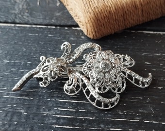 Vintage AVON silver tone filigree openwork floral brooch with trembled rhinestone flower