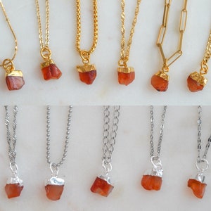 May include: A set of 10 necklaces with carnelian stone pendants. The necklaces are available in two styles: gold chain with gold-plated carnelian and silver chain with silver-plated carnelian.