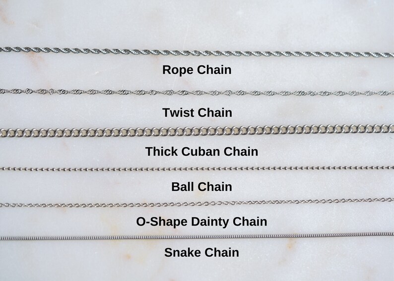 May include: A close-up of six different types of silver chains: rope, twist, thick Cuban, ball, O-shape dainty, and snake.