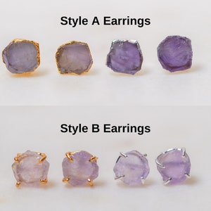May include: Two styles of amethyst earrings. Style A features a simple, raw amethyst stone with a gold setting. Style B features a raw amethyst stone with a gold setting and a small, decorative wire frame.