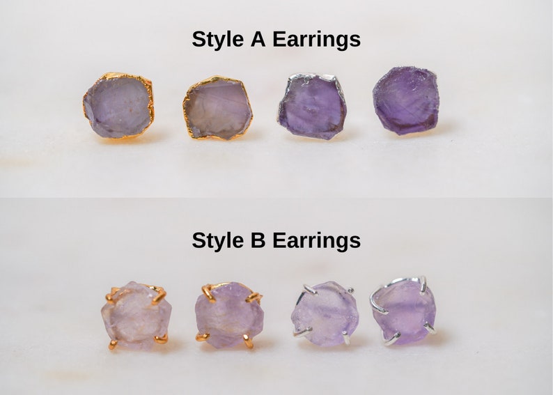 May include: Two styles of amethyst earrings. Style A features a simple, raw amethyst stone with a gold setting. Style B features a raw amethyst stone with a gold setting and a small, decorative wire frame.
