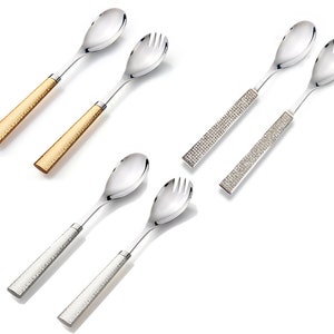 May include: Three sets of salad servers with different handle finishes. One set has a hammered gold finish, one has a hammered silver finish, and one has a clear crystal finish.