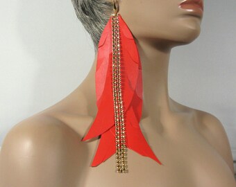 A pair of large papaja red earrings, approx. 23 cm long, wild and cheeky, hand-cut from genuine leather with gold-plated surgical steel ear hooks