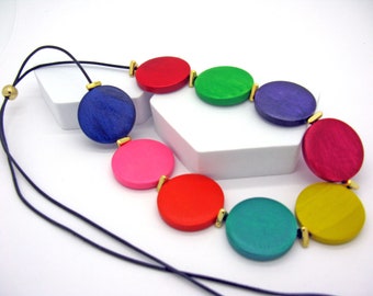 Rainbow colored wooden bead necklace, hand painted beads with gold or silver ceramic beads, threaded on very soft leather