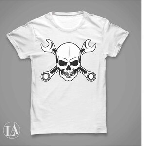 May include: White t-shirt with a black skull and crossbones design featuring two wrenches.