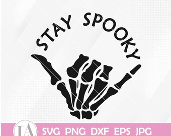 May include: Black and white graphic of a skeleton hand making a shaka sign. The words "STAY SPOOKY" are arched above the hand. Below the image are the file type abbreviations: SVG PNG DXF EPS JPG.