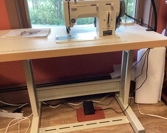 Reliable Barracuda 200ZW walking foot sewing machine with table.
