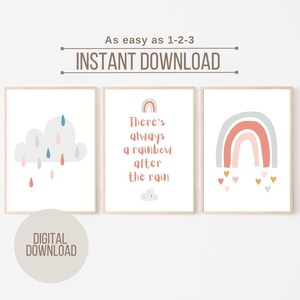 May include: Three framed wall art prints featuring a light gray cloud with blue and pink raindrops, the text "There's always a rainbow after the rain" with a small rainbow and cloud, and a rainbow with small colorful hearts at the bottom.