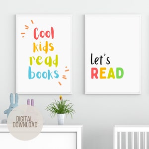 May include: Two white framed prints with colorful text. The left print says "Cool kids read books" in a rainbow of colors. The right print says "let's READ" in a rainbow of colors.
