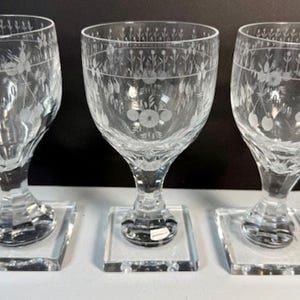 May include: A set of three ceramic mugs with a speckled, matte finish. The mugs are in shades of cream, light gray, and dark gray. Each mug has a simple, minimalist design, perfect for coffee or tea.