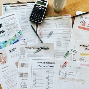 May include: A close-up of a table covered in papers and forms related to filing taxes. There are several receipts, a calculator, a pencil, and paper clips. The papers include a tax form scavenger hunt, a tax slip checklist, and a receipt from a soup kitchen.