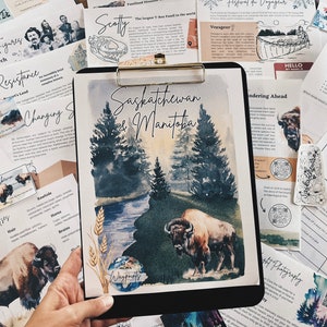 May include: A watercolor illustration of a forest scene with a river and a bison. The illustration is on a clipboard with the words "Saskatchewan & Manitoba" written at the top. The words "Waypoints" are written in a circle at the bottom of the illustration.