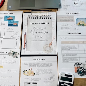 May include: A workbook titled "Teenpreneur: Business & Entrepreneurship Course" by Wonder House Creative. The workbook includes sections on business cards, profits, packaging, and photography. The pages are filled with handwritten notes and sketches.