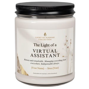 May include: A glass candle jar with a black lid containing off-white wax. The label reads: Light of Purpose Collection, The Light of a VIRTUAL ASSISTANT, Remote and remarkable. Managing everything from everywhere. Indispensable always. [Your Name] — Since [Year].