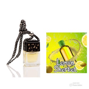 May include: A black and gold car air freshener with a string to hang it from the rearview mirror. The bottle is filled with a yellow liquid and has a label that says "Lemon Sherbet".