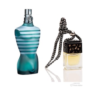 May include: A blue and white striped glass bottle of cologne with a silver atomiser and a black car air freshener with a gold chain.