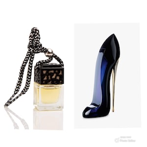 May include: A black and gold car air freshener with a clear glass bottle and a black chain. The bottle is filled with a yellow liquid. The air freshener is shaped like a high heel shoe.