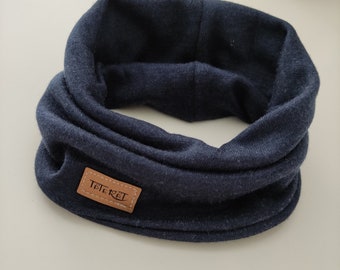 May include: A dark blue neck warmer with a brown leather label that says "Tatertot".