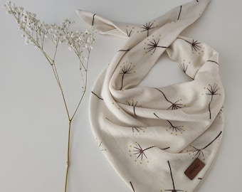 May include: A white cotton bandana with a brown dandelion print. The bandana has a brown leather tag with the text "THE KNOT" on it.