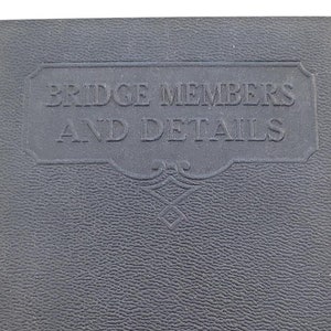 May include: A black leather-bound book titled "Bridge Members and Details" by the International Textbook Company, Scranton, PA.